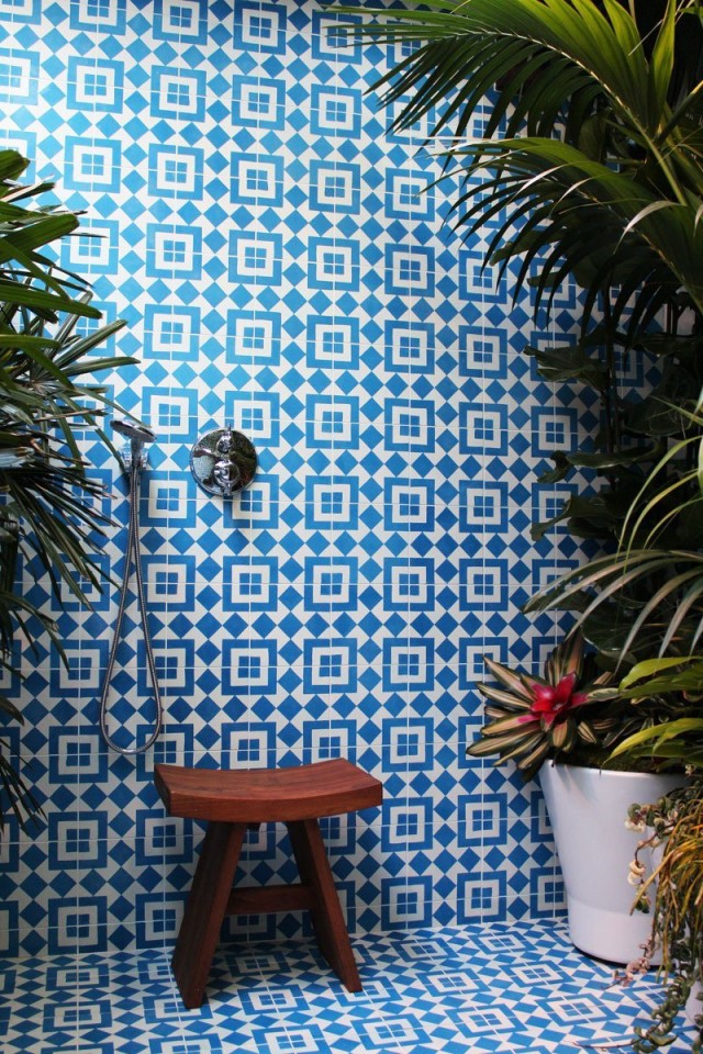 Beautiful blue tile and jungle plants in the shower